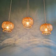 Vintage trio of amber glass pendants, 1960s-70s.