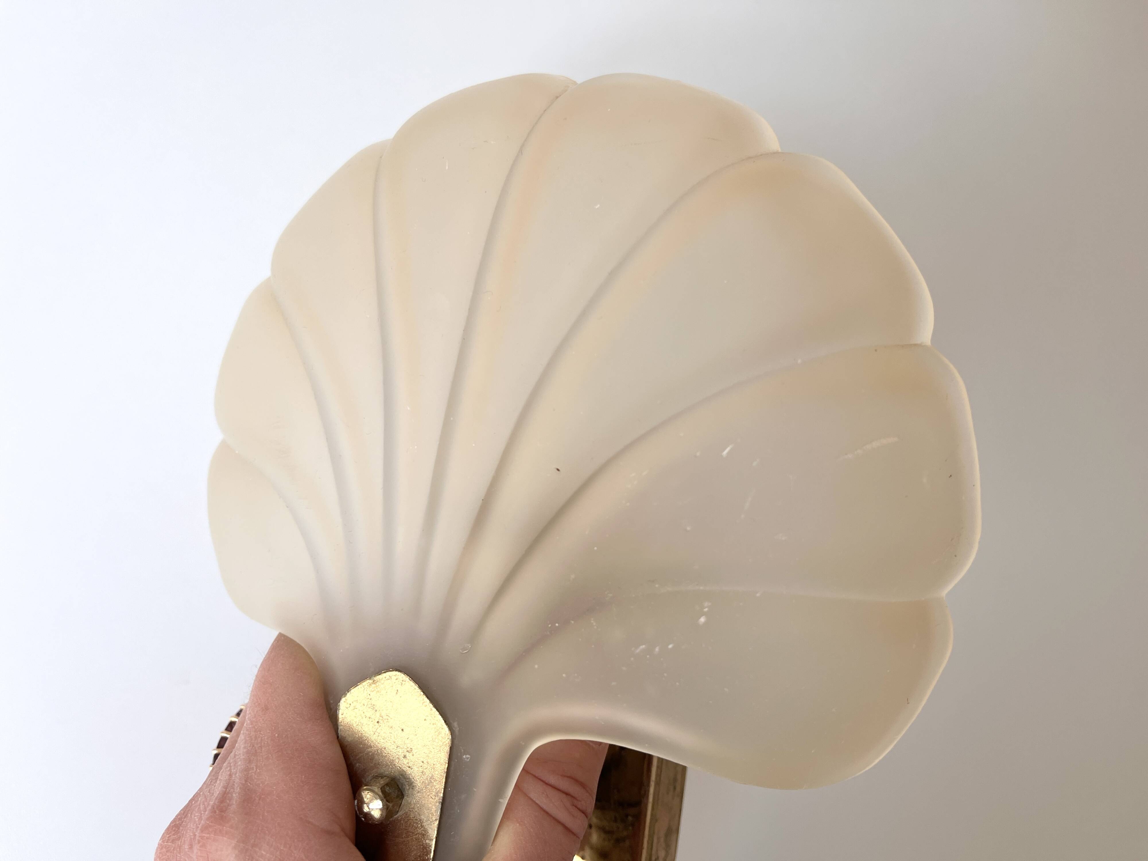 Pair of vintage shell glass wall lights, Art Deco style fixtures.