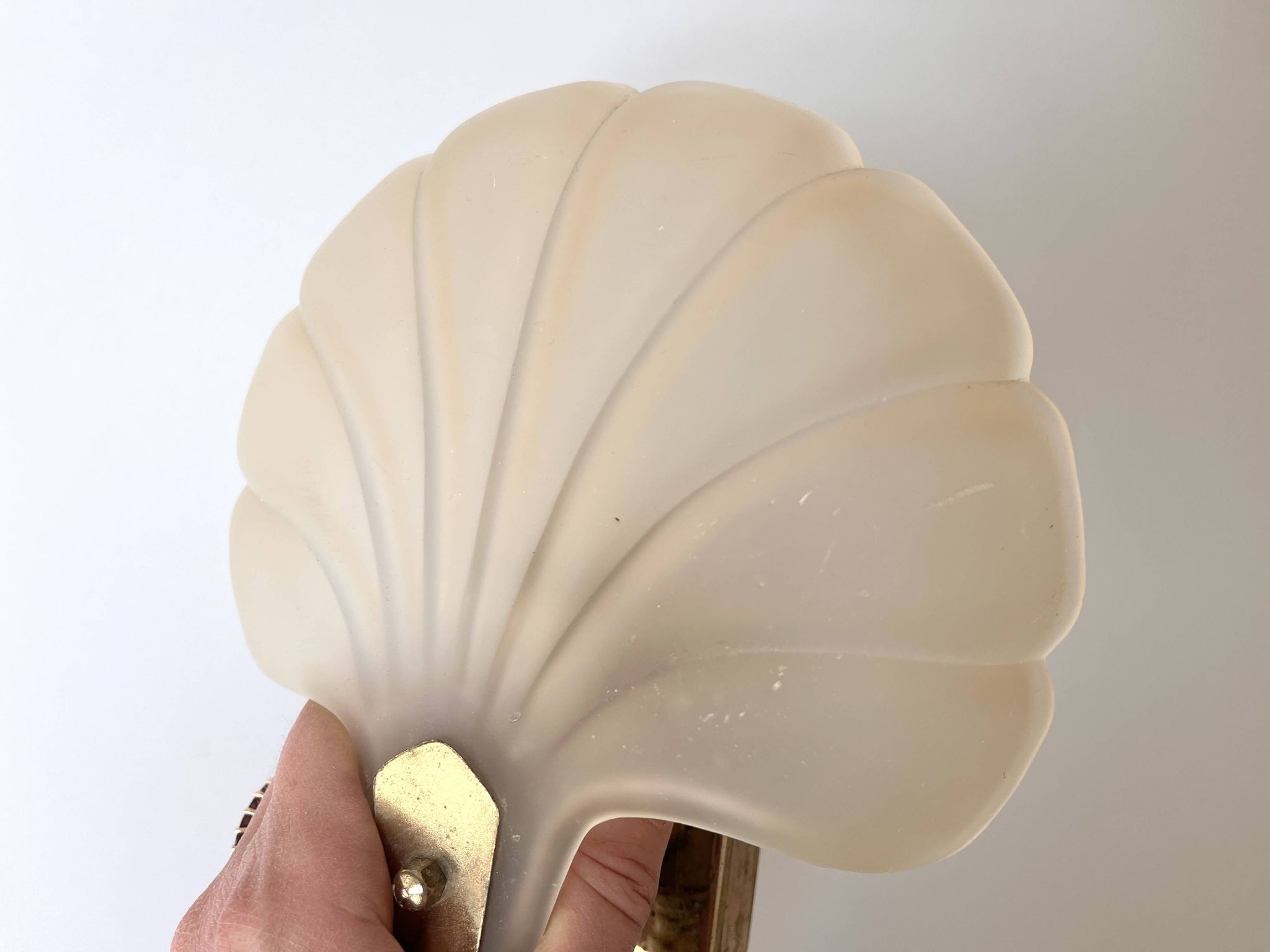 Pair of vintage shell glass wall lights, Art Deco style fixtures.