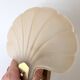 Pair of vintage shell glass wall lights, Art Deco style fixtures.