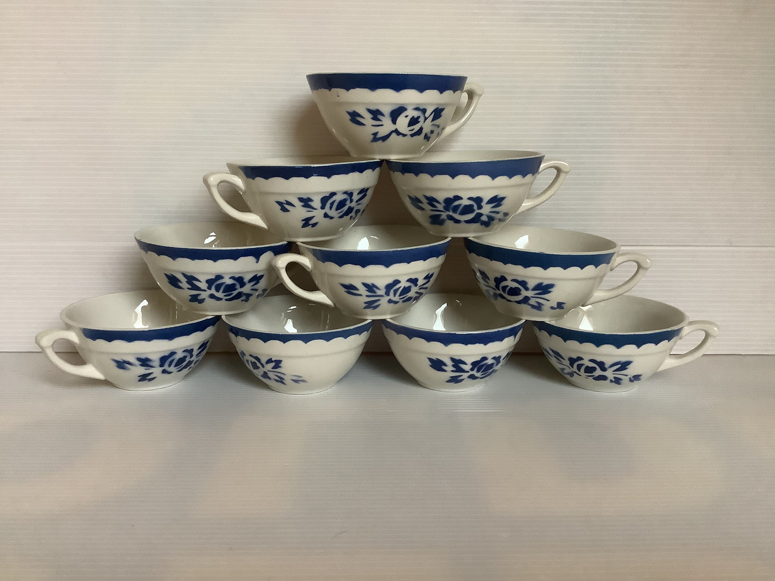 10 old earthenware cups with blue flowers and stencils