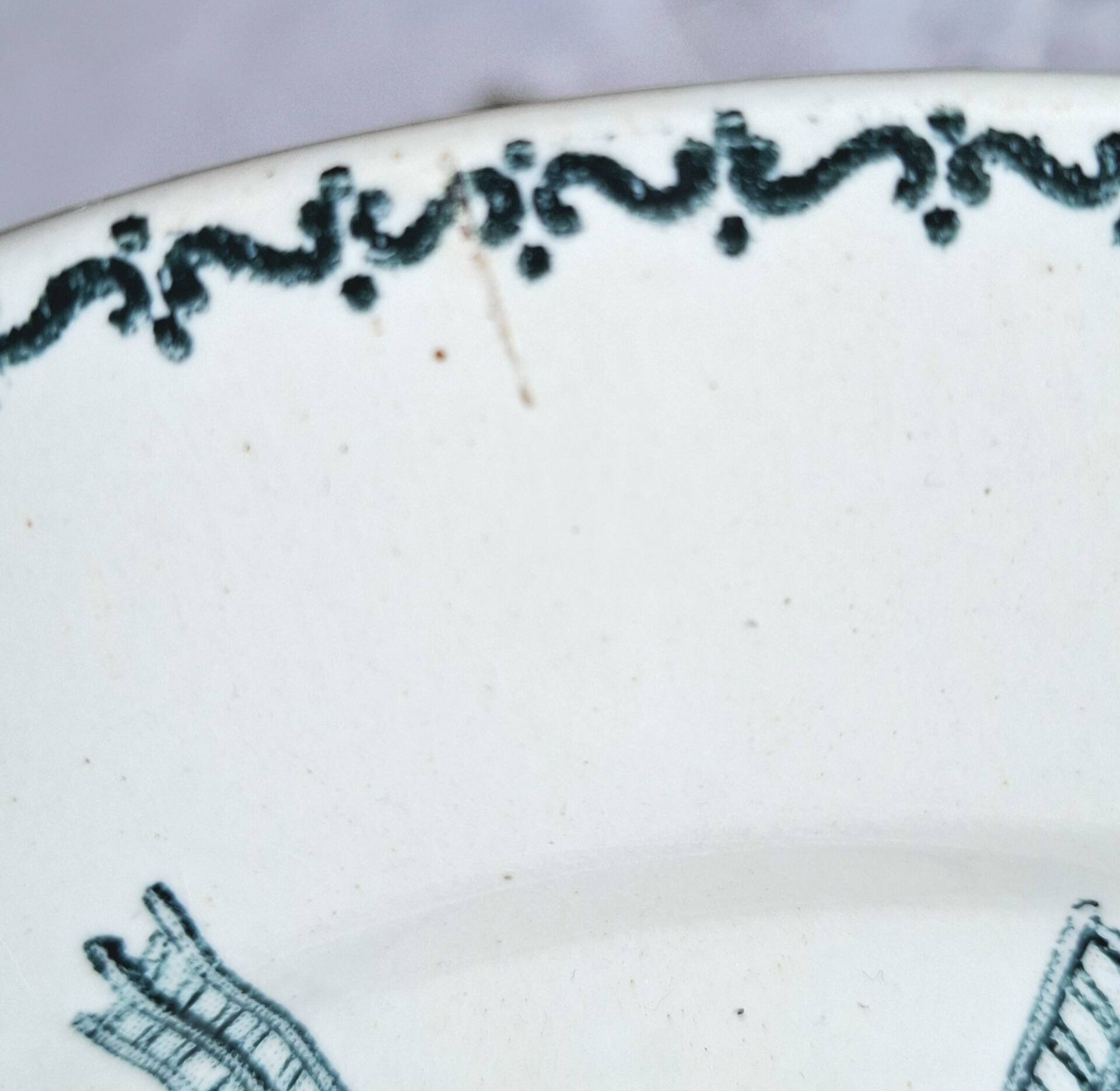 Old mismatched flat plates made of ironstone earthenware.