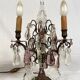 Pair of bronze chandeliers with tassels