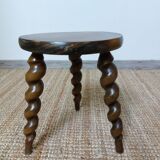 Wooden tripod stool with twisted legs