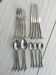 Set of 20 stainless steel cutlery with branch pattern.