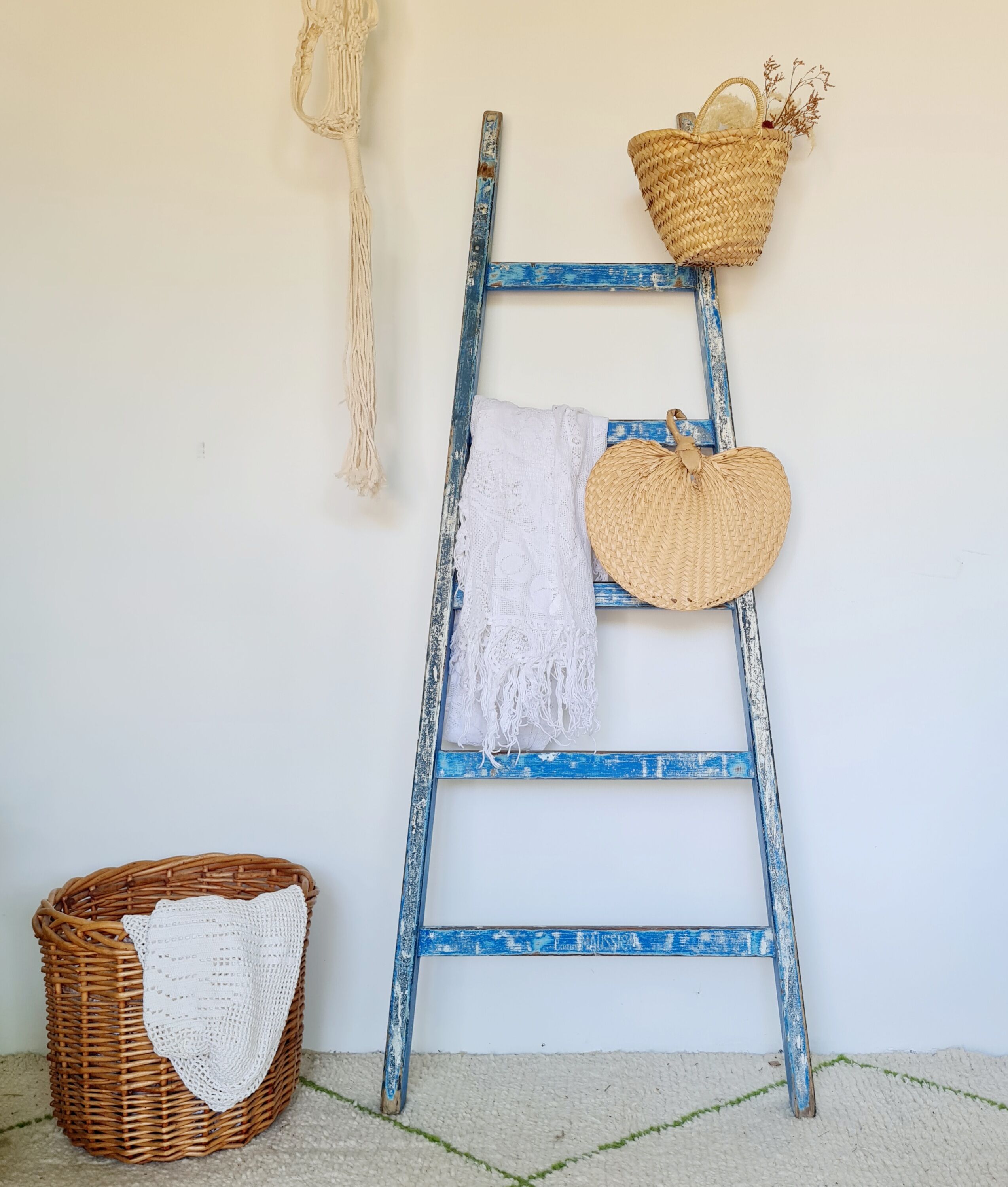 Old ladder in blue wood