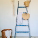 Old ladder in blue wood