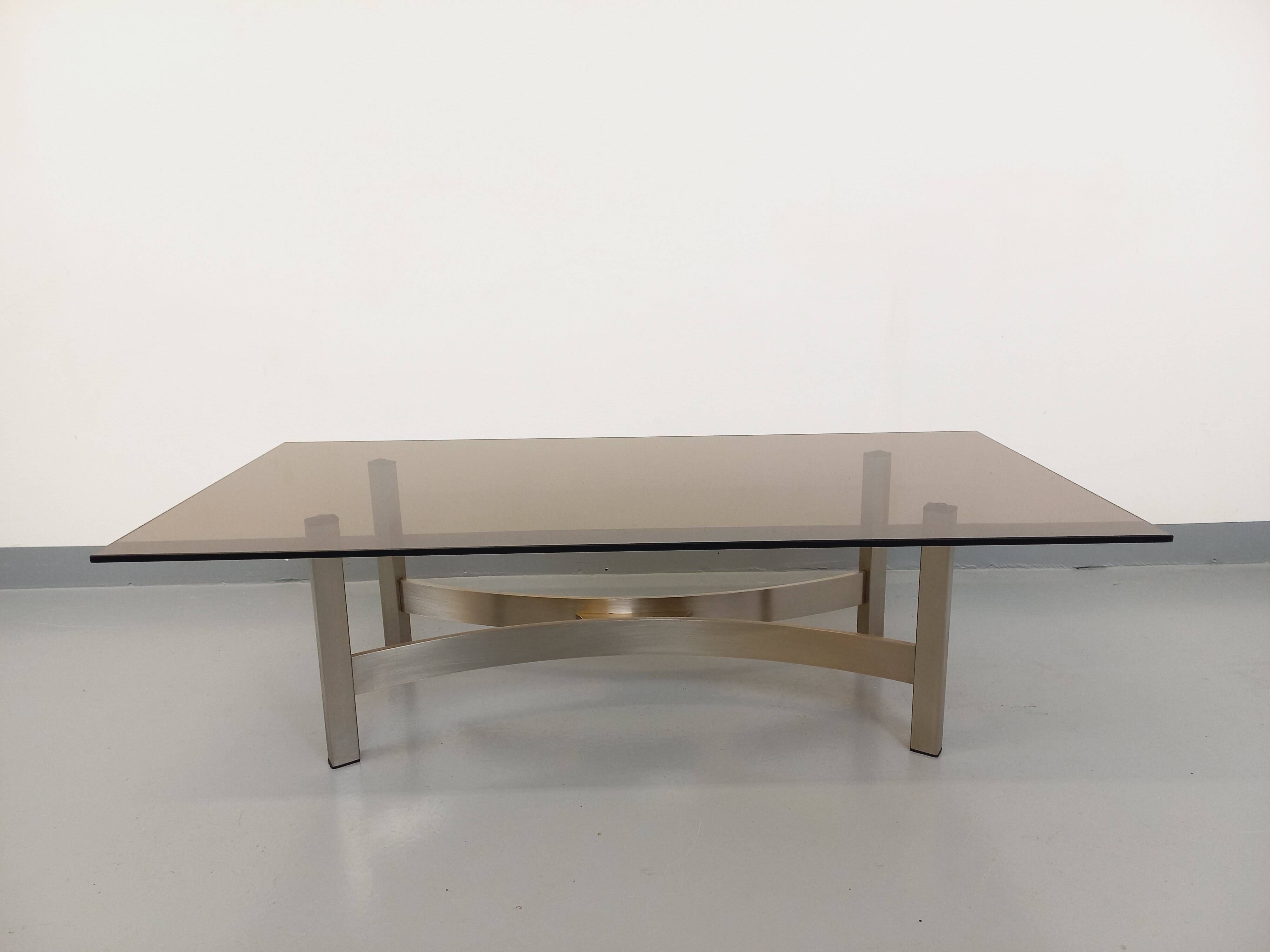 Vintage coffee table in smoked glass and brushed cast aluminum from the 70s