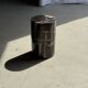 Small side table in black petrified wood with stripes and beige sides H28 D18.