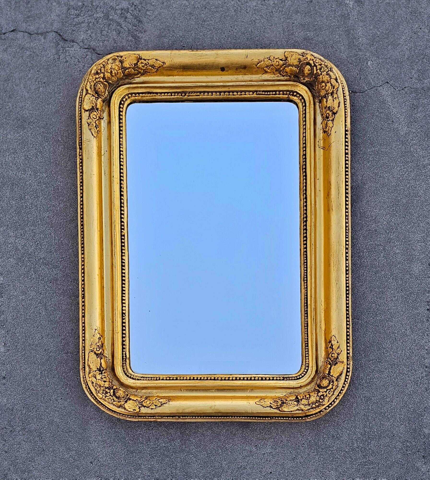 Large Biedermeier gilded mirror in faceted wood, circa 1840.