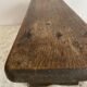 Old low stool made of solid wood