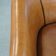 Sheep leather club chair finished with black piping