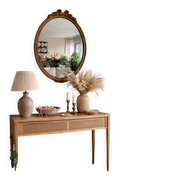 Antique oval mirror in Louis XVI style, gilded, with a bow pediment, 55cm.