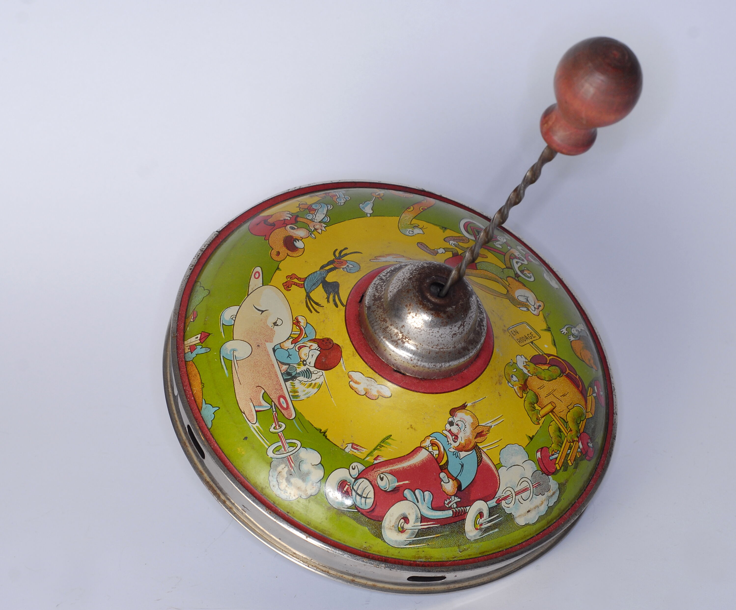 Old lithographed spinning top dating from the 1930