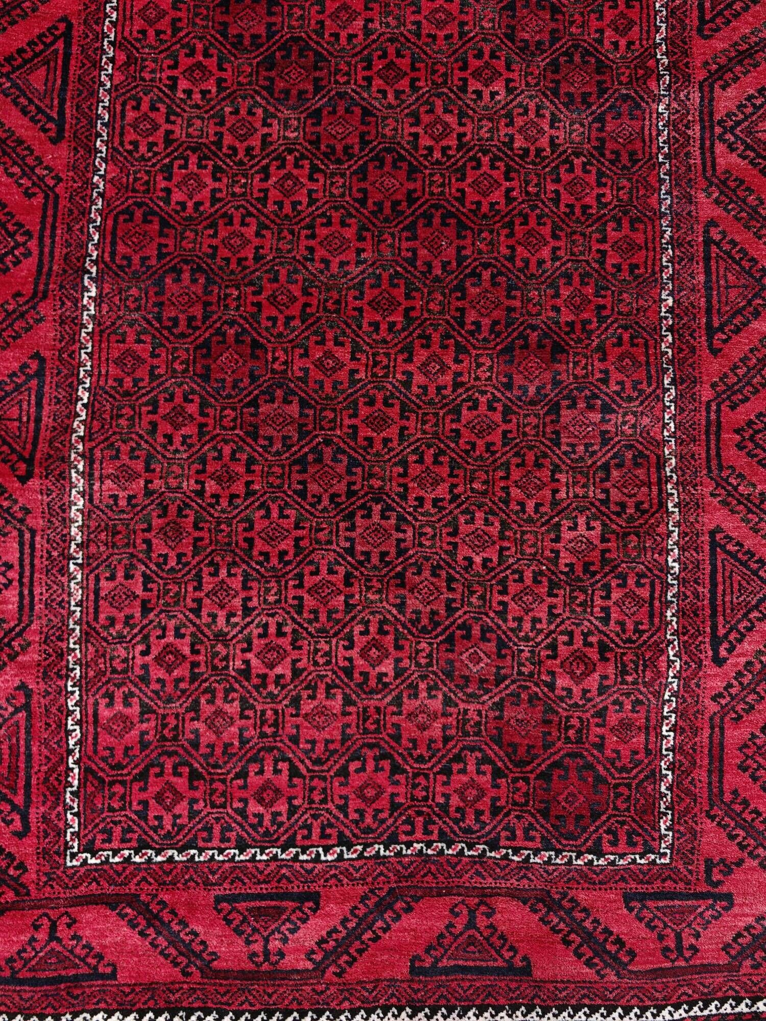 Vintage handmade Baluch rug with geometric pattern from the 1950s.