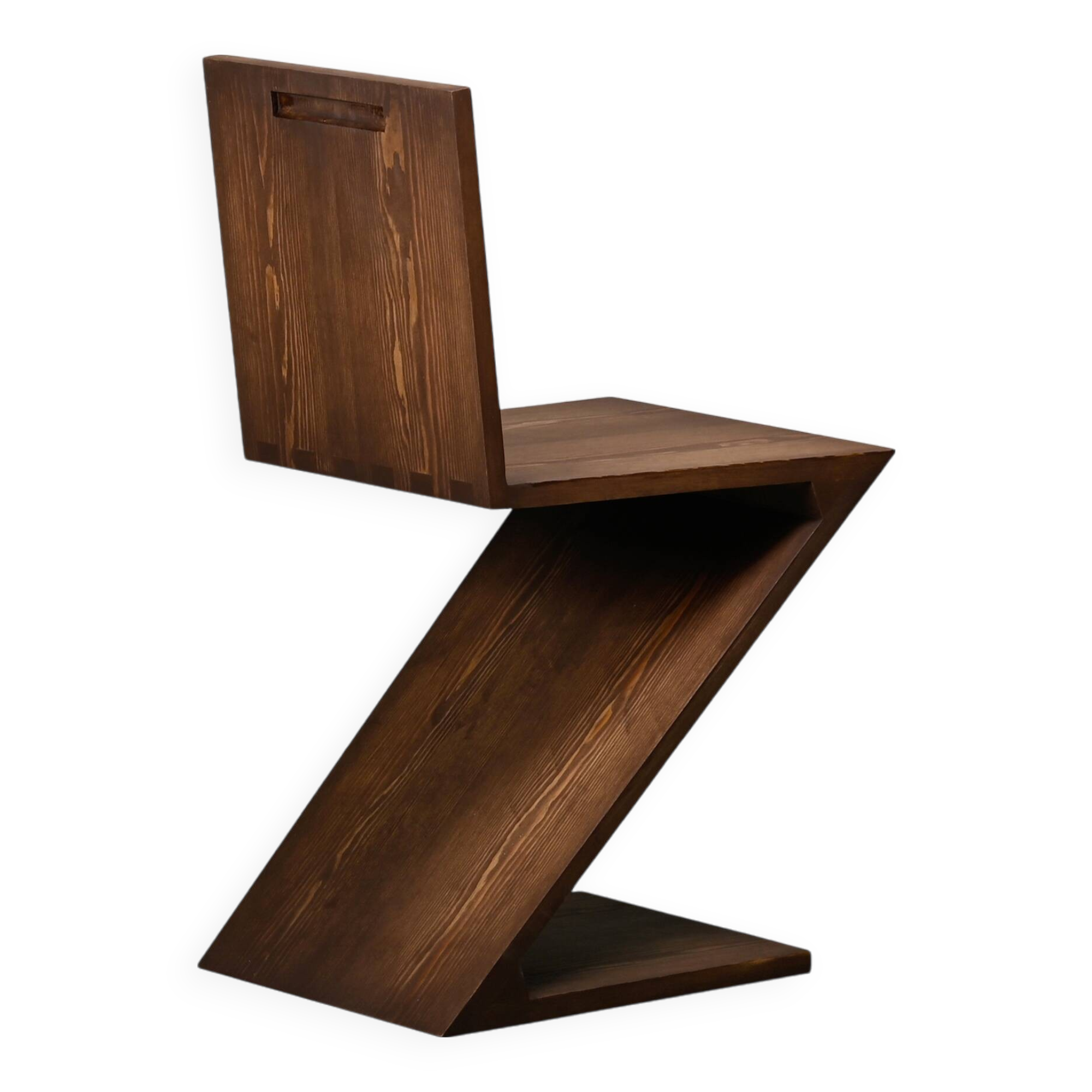 Gerrit Rietveld Zig Zag Chair is dark brown stained wood