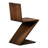 Gerrit Rietveld Zig Zag Chair is dark brown stained wood