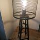 Industrial lamp in black metal to pose.
