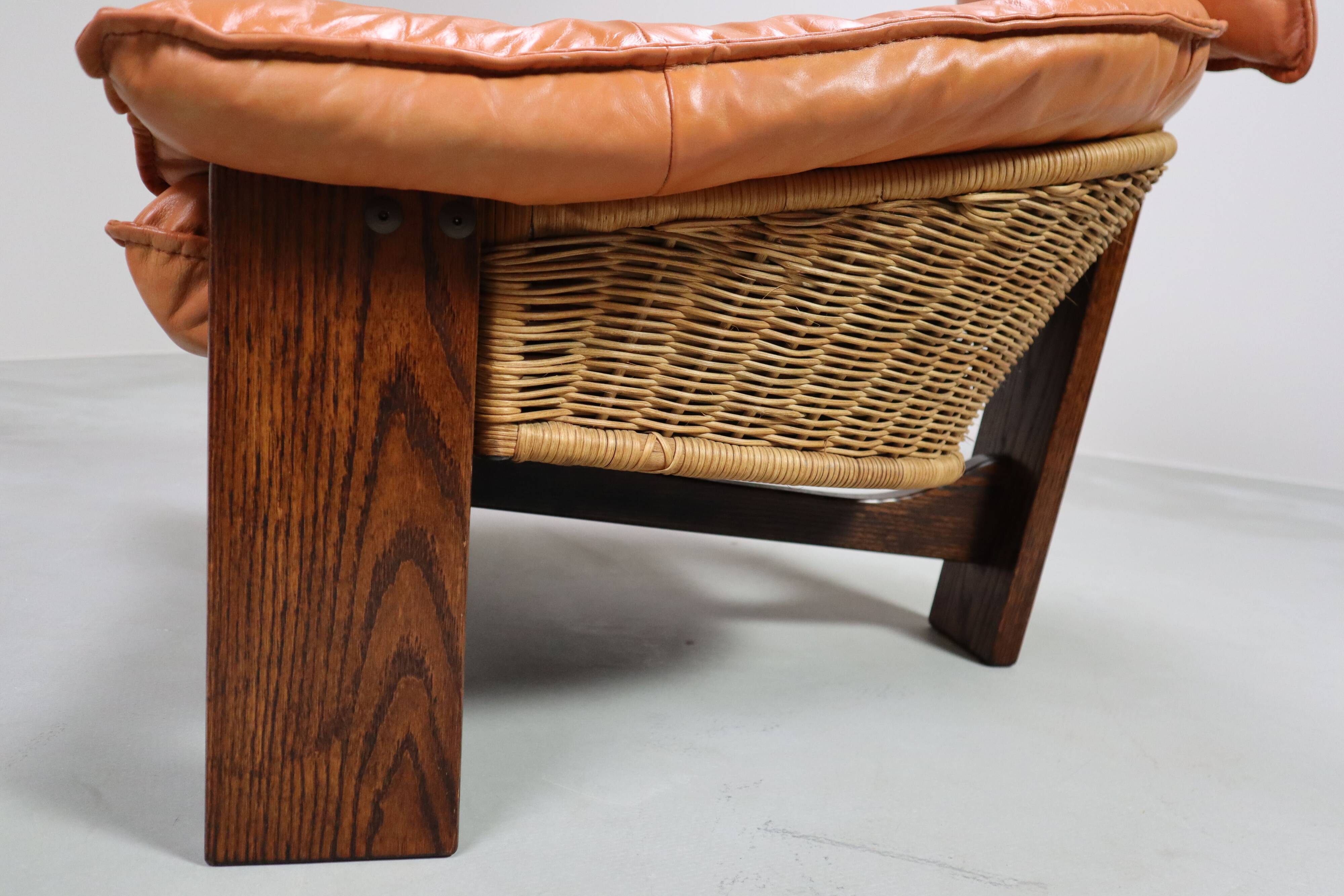 Vintage tripod lounge chair in leather, rattan and oak, Netherlands