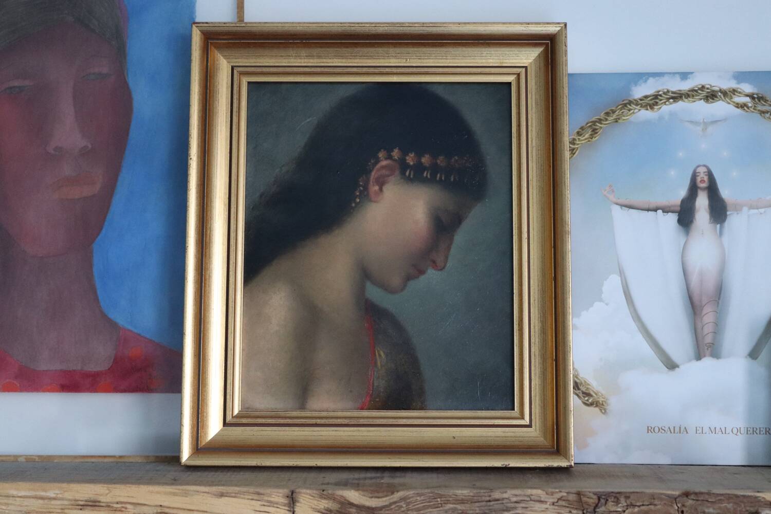 Old oil portrait of a woman on panel