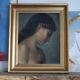 Old oil portrait of a woman on panel