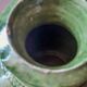 Ancient vase in glazed terracotta with green glaze.