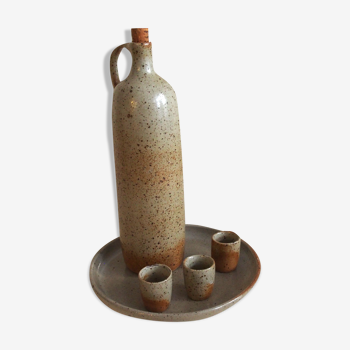 Signed sandstone bottle with cups and tray