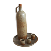 Signed sandstone bottle with cups and tray