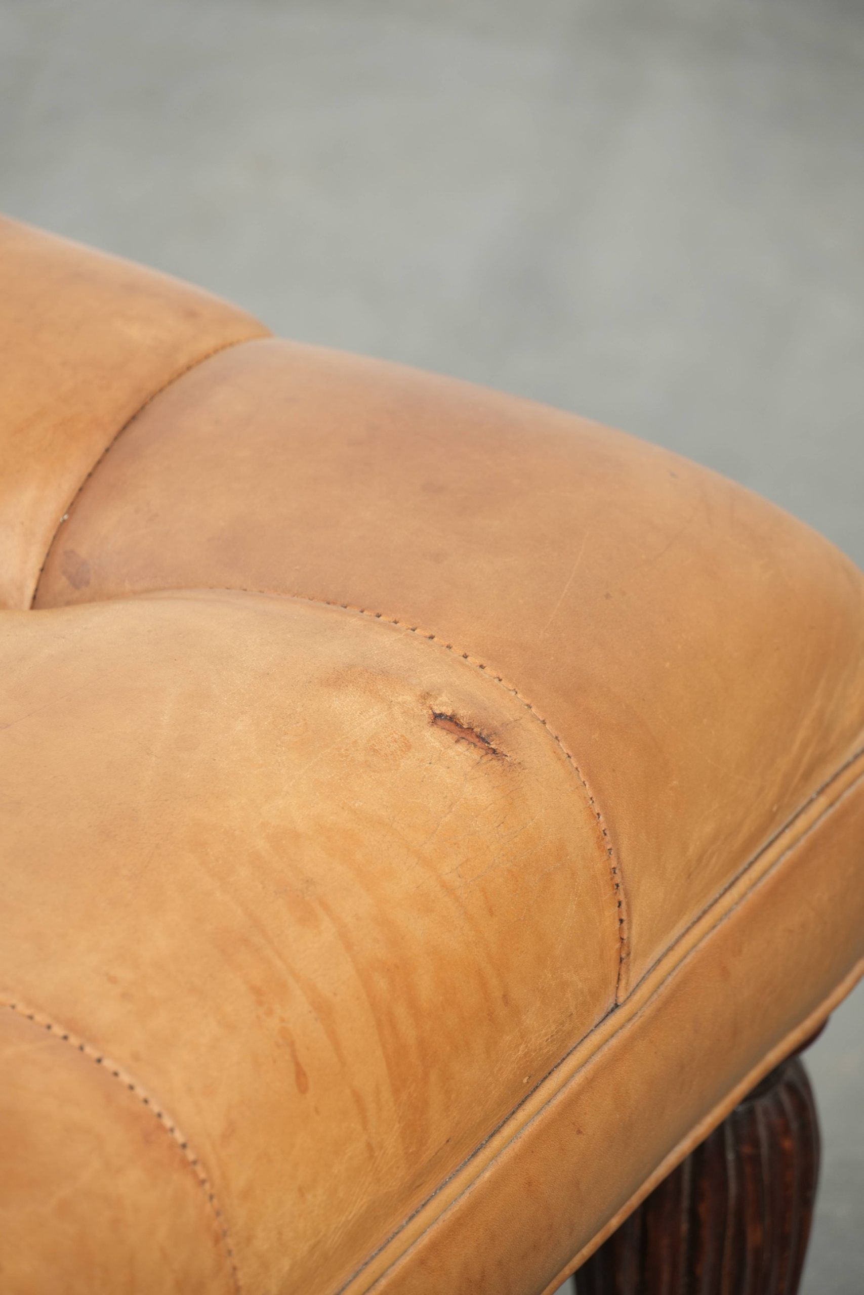 Sheepskin ottoman/coffee table on wheels in English chesterfield style