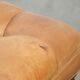 Sheepskin ottoman/coffee table on wheels in English chesterfield style