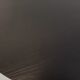 Vintage dining table in melamine with a black wood effect and chrome metal.
