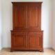 Antique solid wood sideboard with doors and drawers.