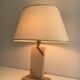 Travertine lamp with brass inlay