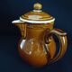 Old covered milk jug, side handle
