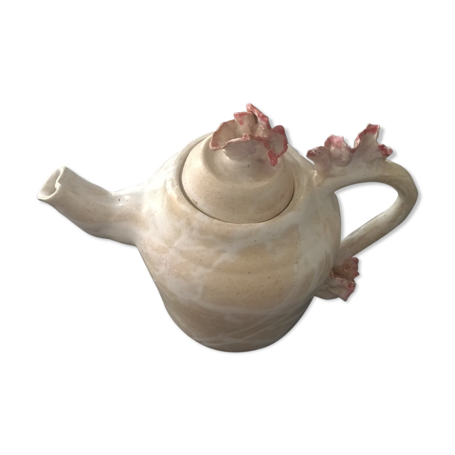 Vintage teapot with relief coral decoration.