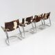 Vintage dining room chairs chrome and cowhide by Parravicini Fratelli