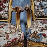 Pair of Louis XV style Baroque armchairs in gilded and carved wood circa 1900