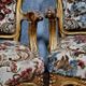 Pair of Louis XV style Baroque armchairs in gilded and carved wood circa 1900
