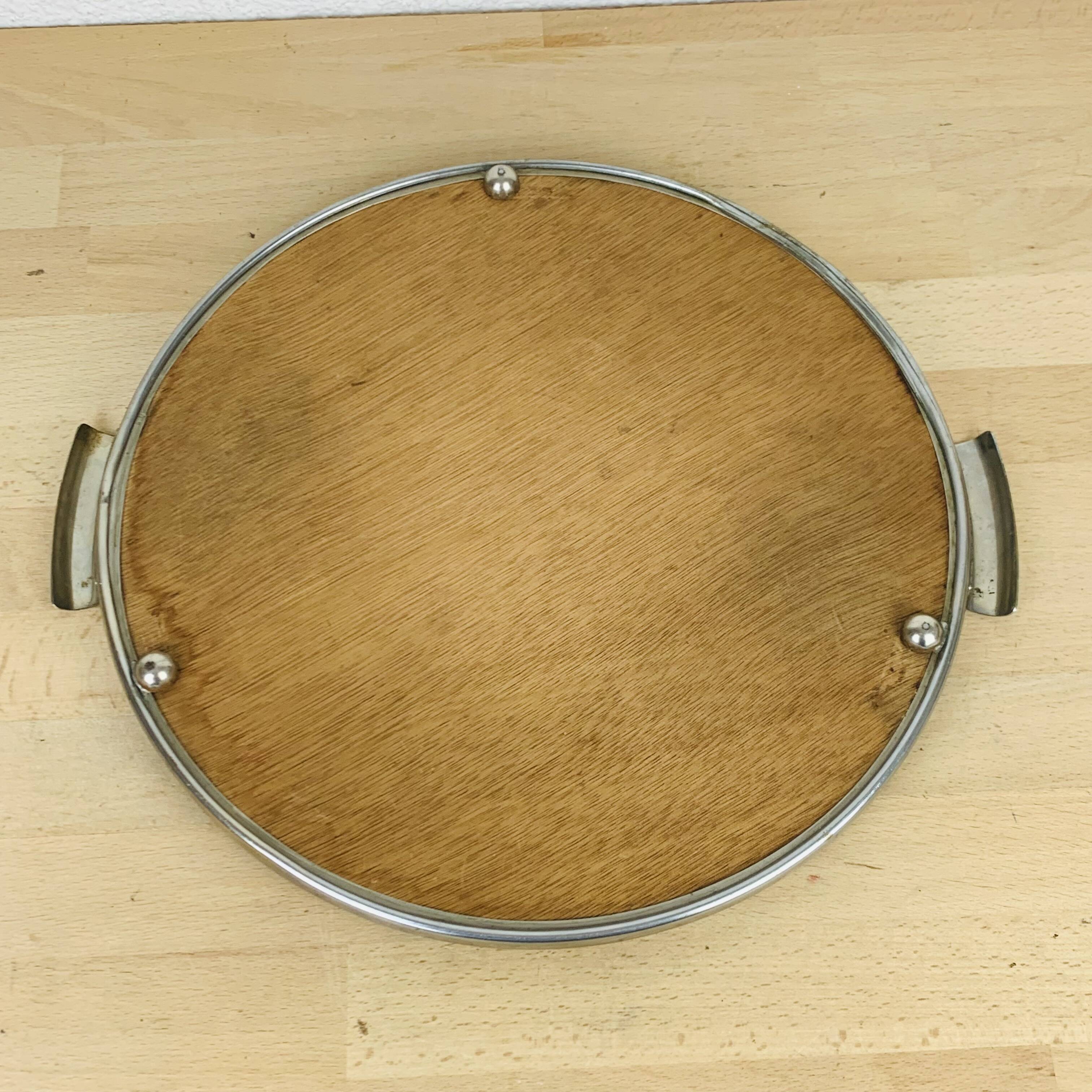 Round mirror plateau from the 1950s.