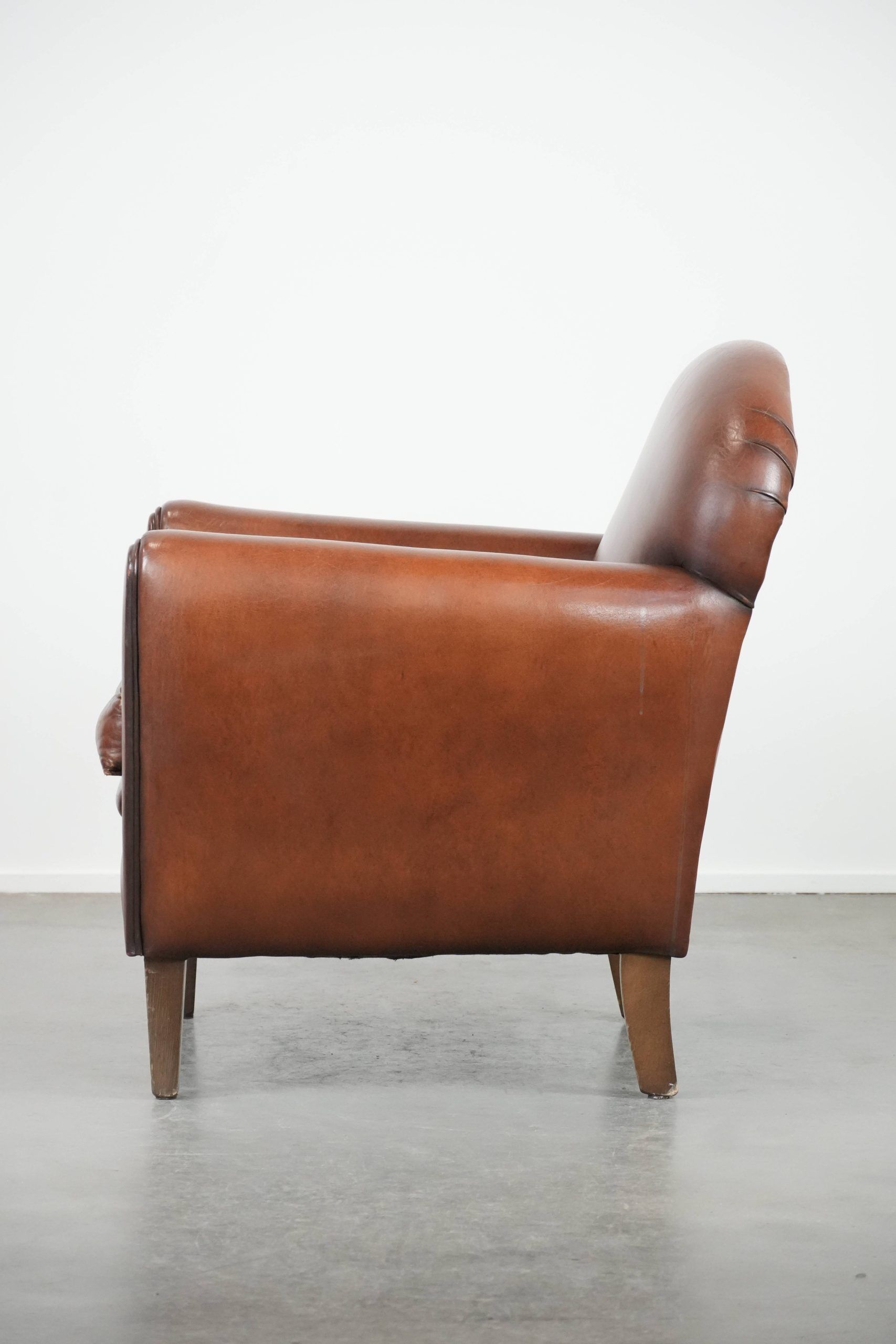 Sheepskin art deco design armchair with timeless and warm colours