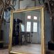 Restoration period mirror in gilded wood from the Napoleonic III era, 165 cm x 130 cm.