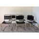 Series of 6 minimalist chairs in chrome metal and black leather around 1970