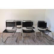 Series of 6 minimalist chairs in chrome metal and black leather around 1970