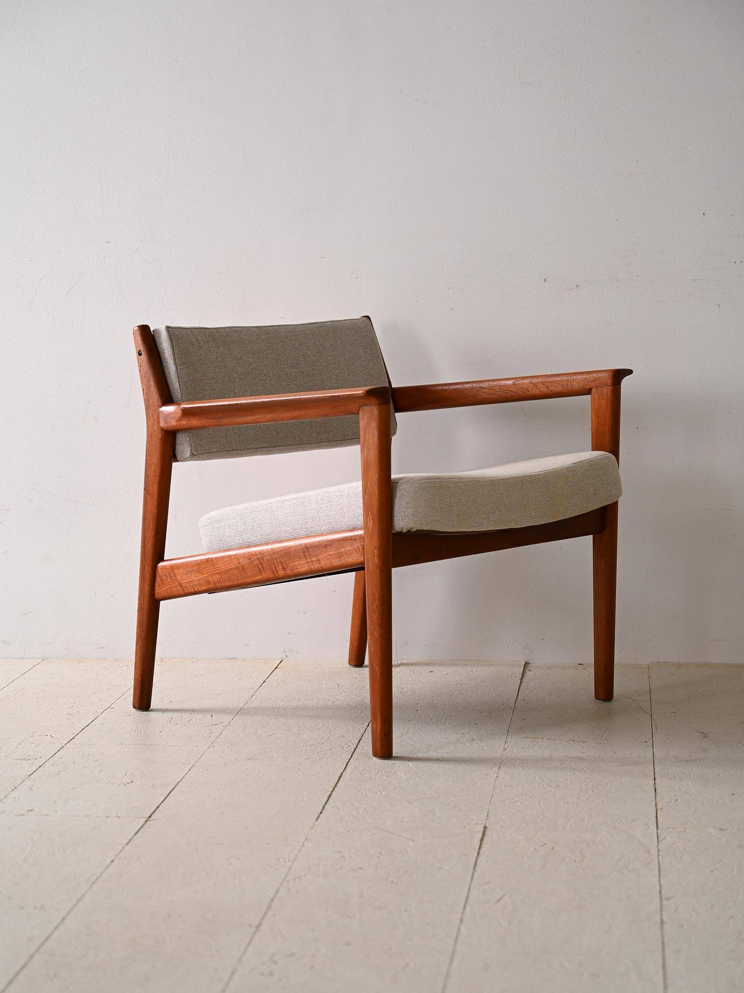 Upholstered armchair with teak frame
