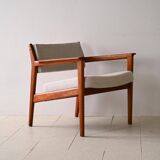 Upholstered armchair with teak frame