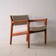 Upholstered armchair with teak frame