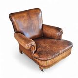 fauteuil club en cuir de mouton anglais ancien avec accoudoirs