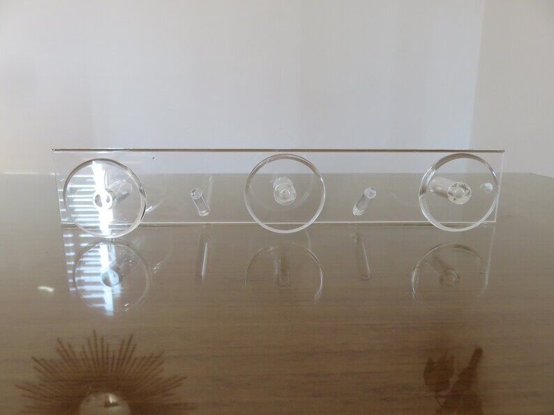 Wall coat rack in transparent plexiglass 3 hooks. 1980