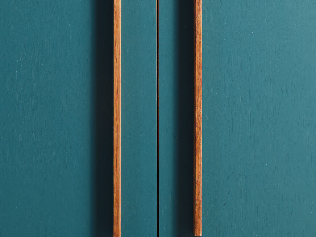 Vintage low sideboard restyled in blue with 2 swing doors and wooden base