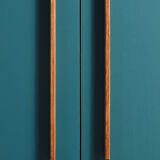 Vintage low sideboard restyled in blue with 2 swing doors and wooden base